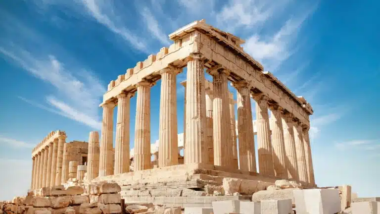 The Parthenon framed by a blue sky.