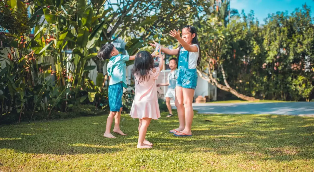 children playing with bubbles