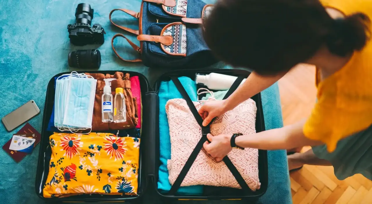 woman packing suitcase for vacation