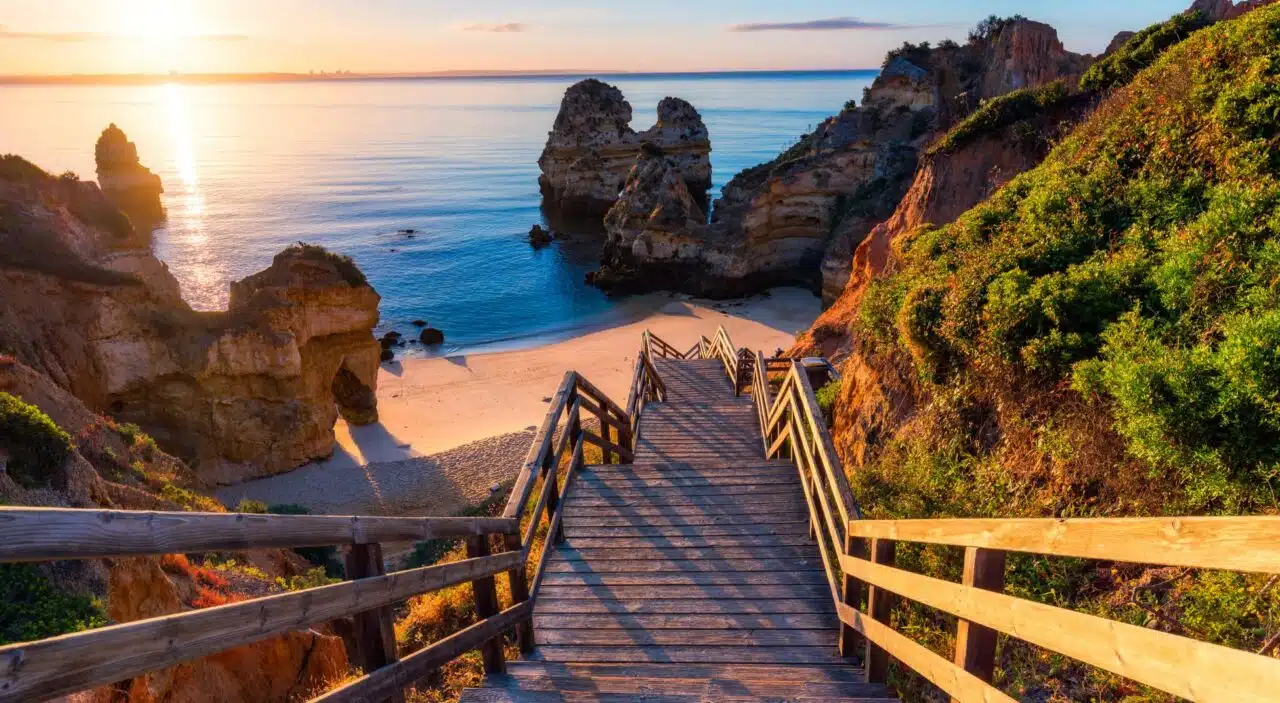 Sunrise at Camilo Beach with wooden boardwalk leading down to sandy beach