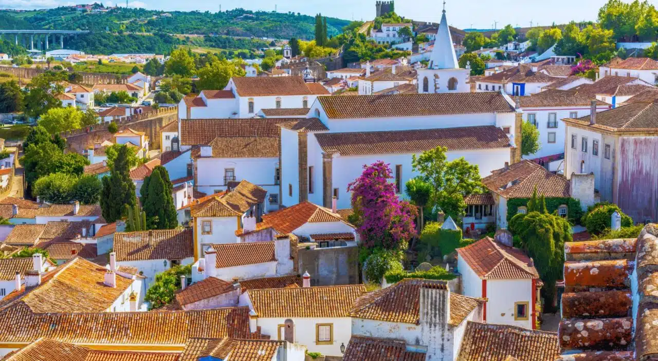 View of red tile rooftops in the medieval town of Obidos, Portugal